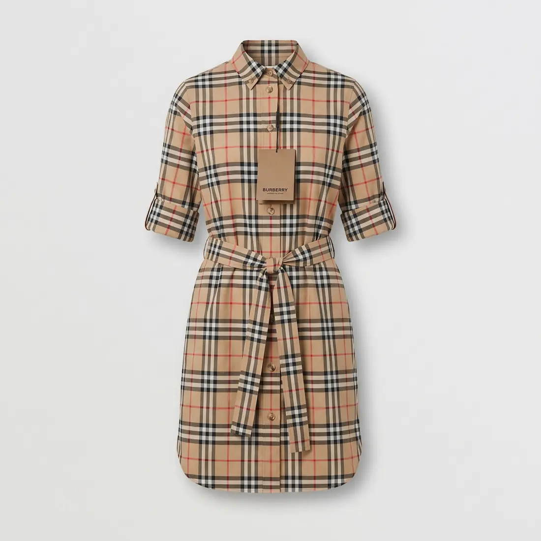 A check shirt dress photographed as a clean studio product shot