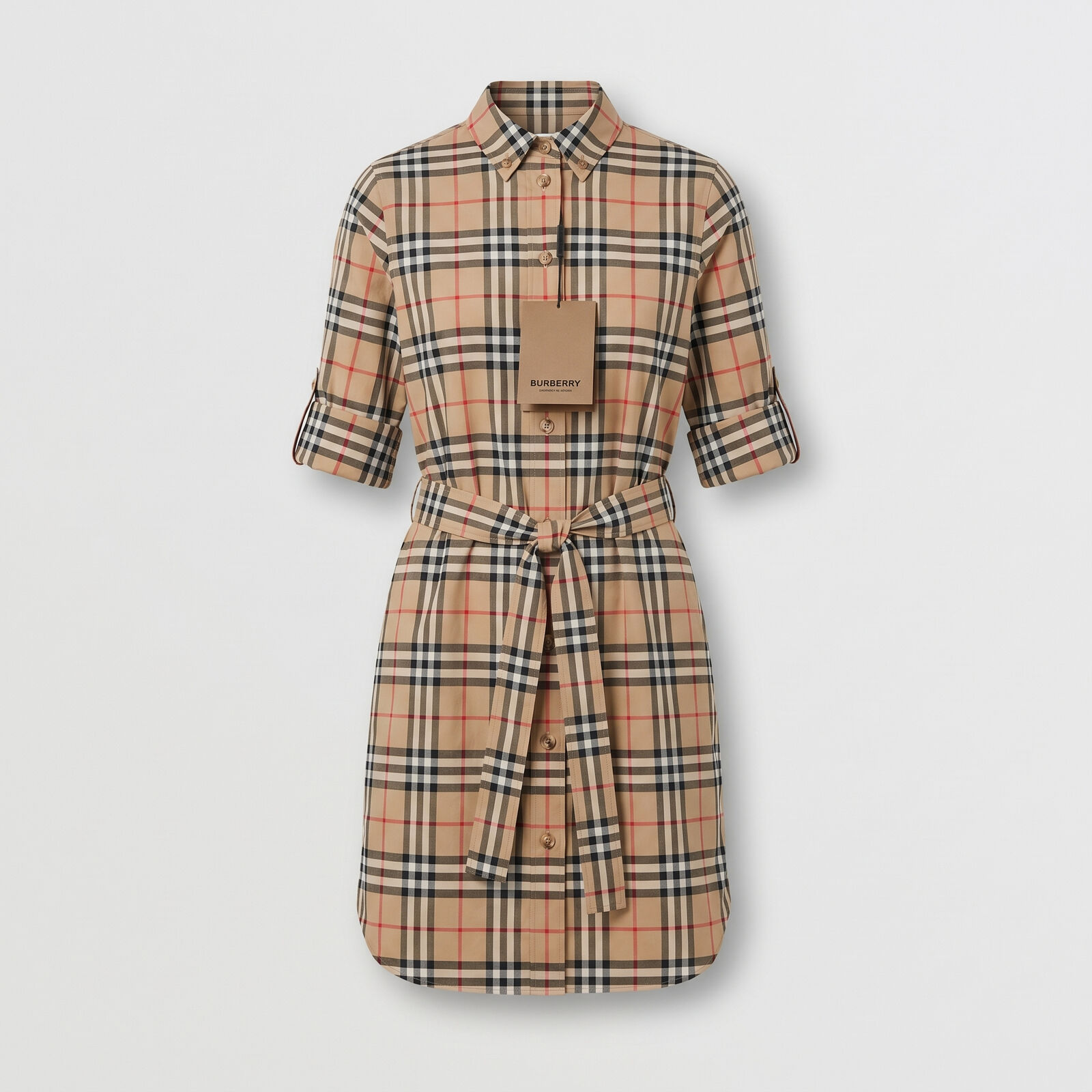 A check shirt dress photographed as a clean studio product shot